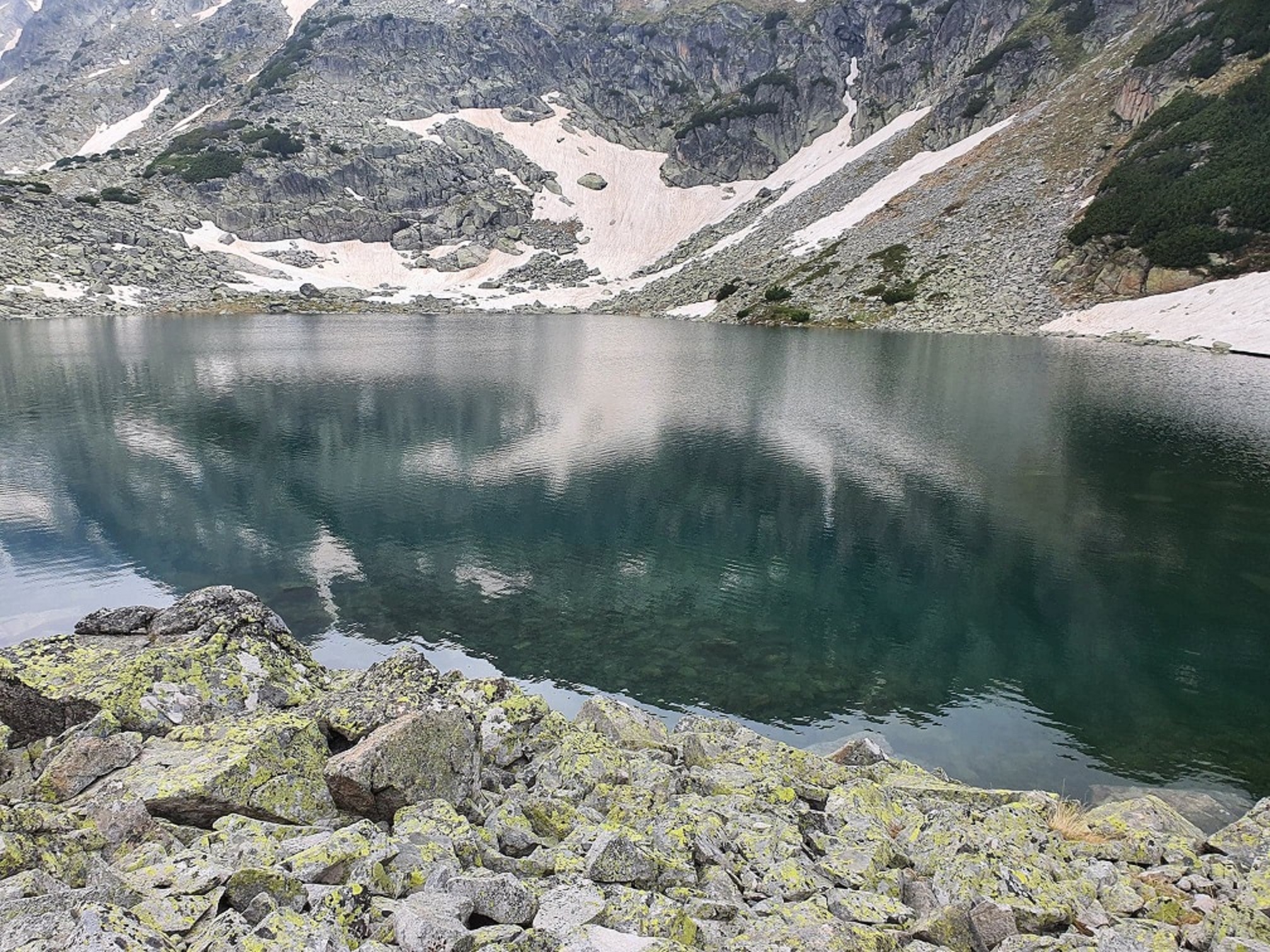 beautiful mountain landscape with ice and rocks and steep hills and lakes