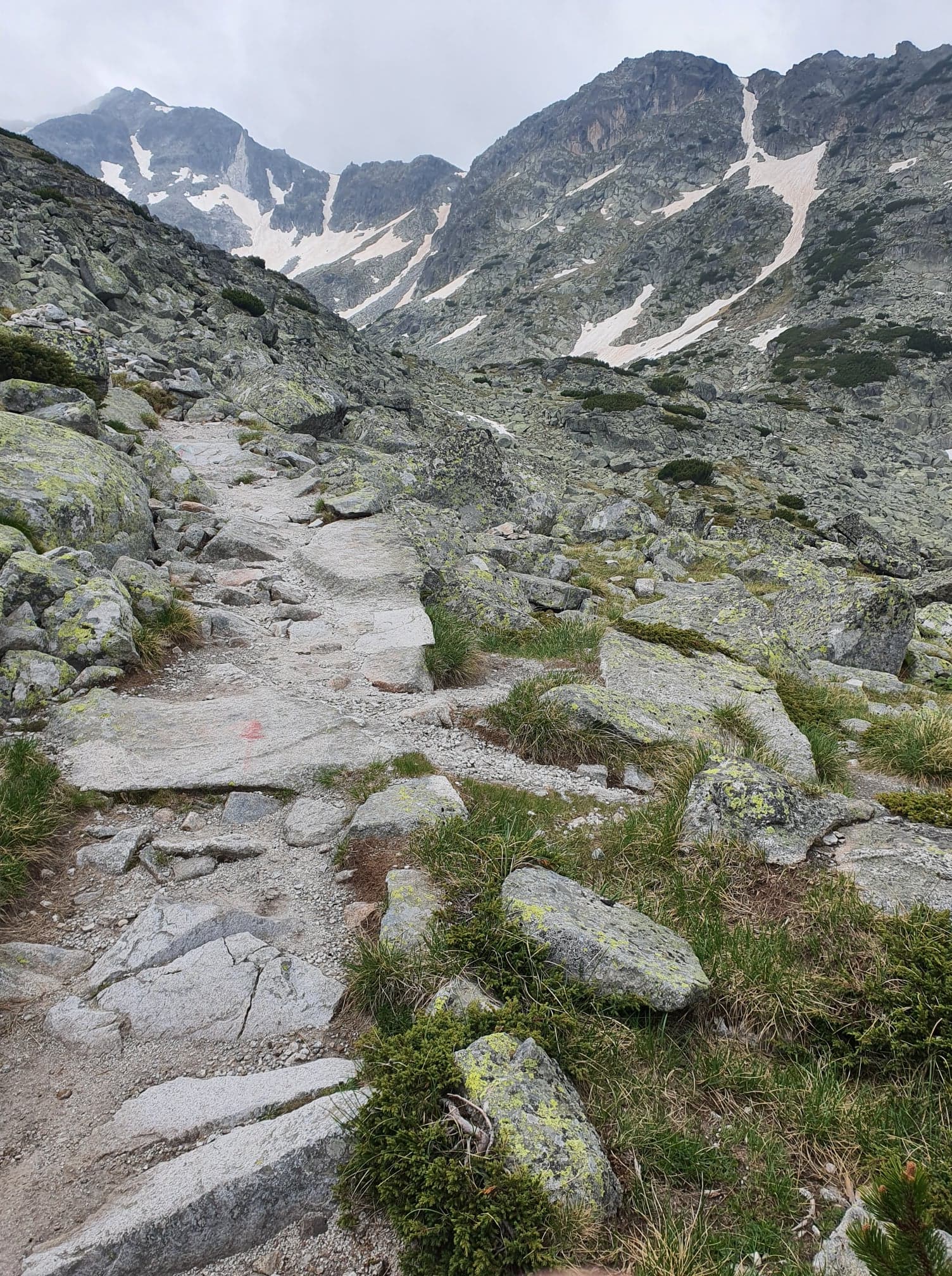 beautiful mountain landscape with ice and rocks and steep hills and lakes