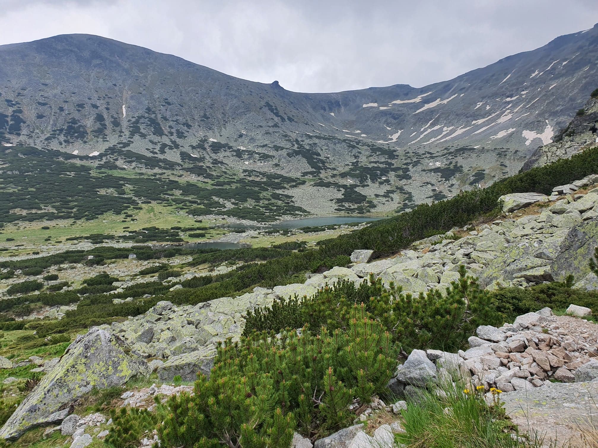beautiful mountain landscape with ice and rocks and steep hills and lakes