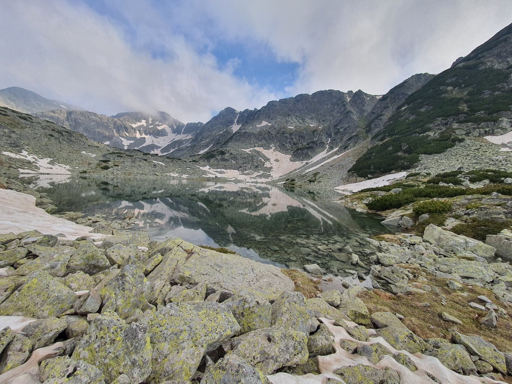 beautiful mountain landscape with ice and rocks and steep hills and lakes