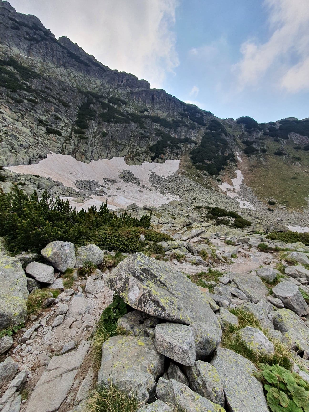 beautiful mountain landscape with ice and rocks and steep hills and lakes